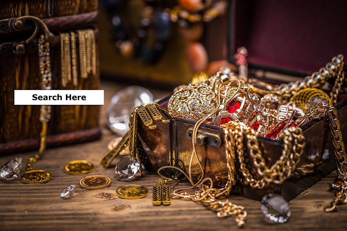 Pirate treasure chest full of jewelry and coins