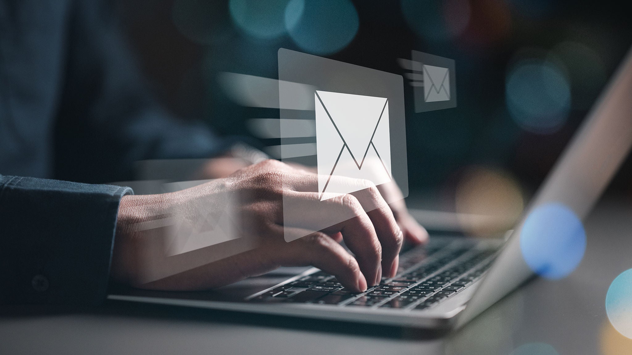 Person typing on keyboard to send email contact message