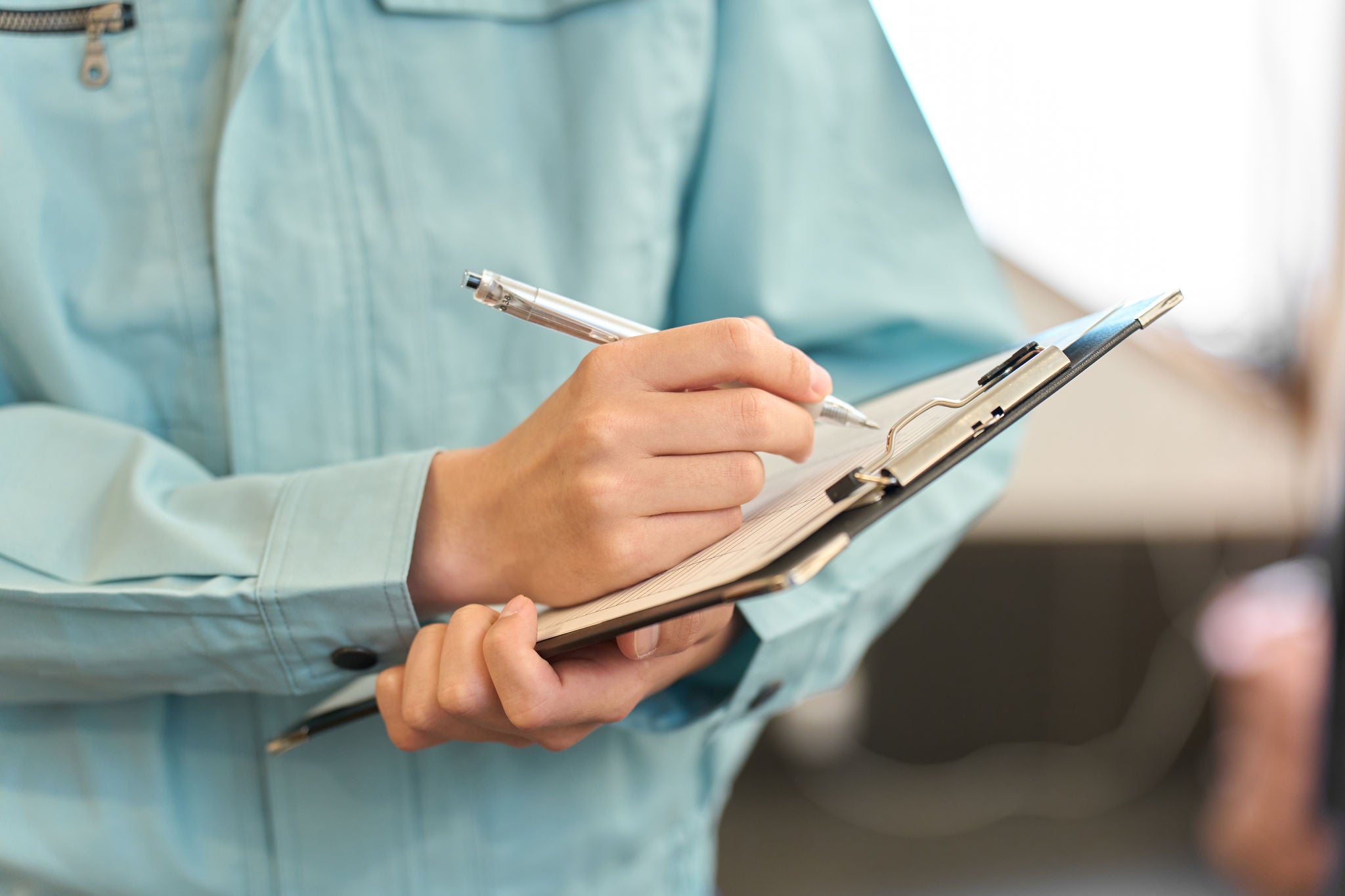 A man in work clothes inspecting a restaurant