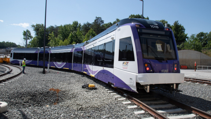 Purple and gray metro train on the tracks