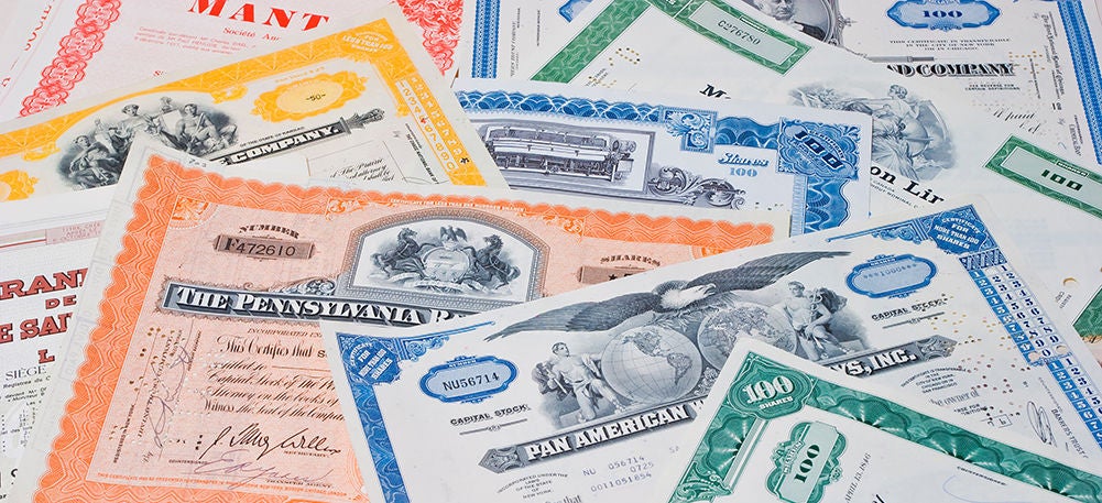 photo depicting pile of physical certificates