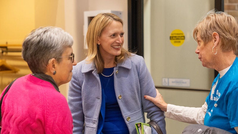 Comptroller Lierman speaking with two women