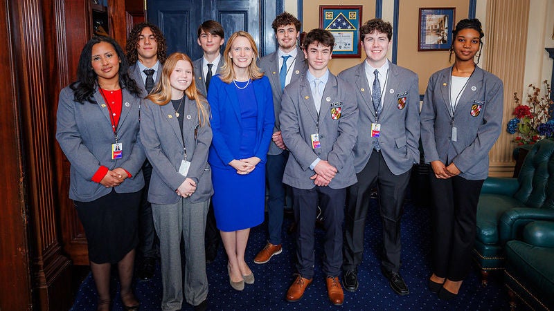 Comptroller Lierman standing with a group of pages on opening day of 2026 legislative season
