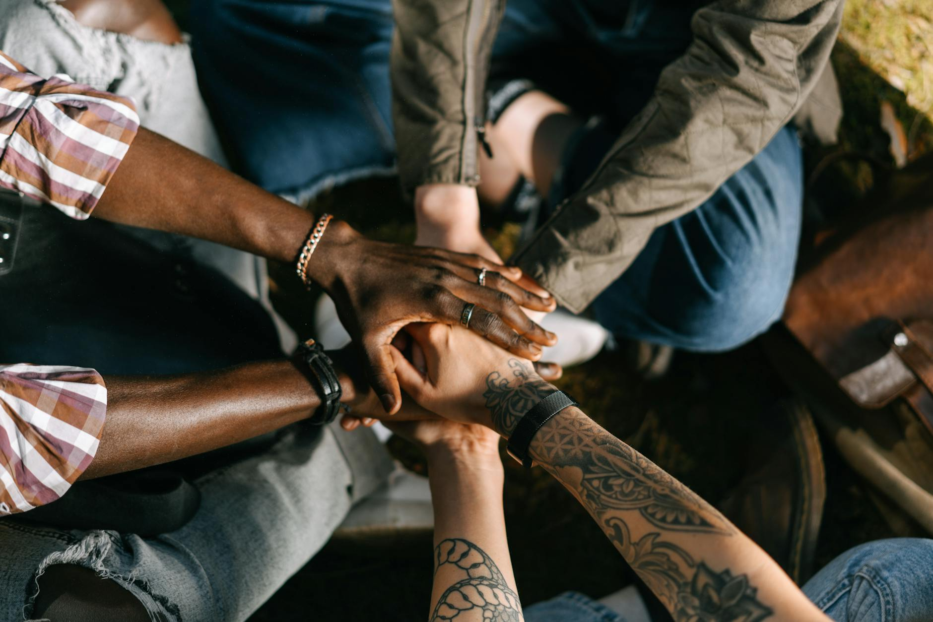 Multi ethnical hands in a group on top of each other