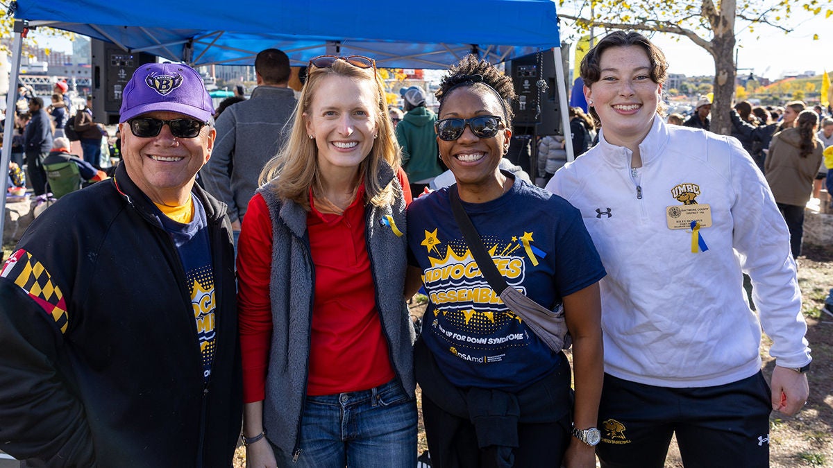 Comptroller Lierman posing with three people outside the fall