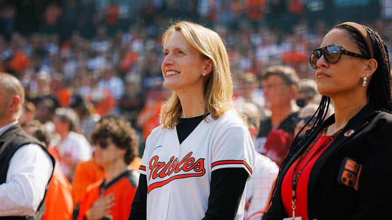 Comptroller Lierman participates in the Orioles Opening Day festivities at Camden Yards. She is smiling while wearing an O's jersey